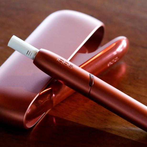 FILE PHOTO: Electric tobacco heating system IQOS of cigarette maker Philip Morris Switzerland is displayed after a news conference in Bern