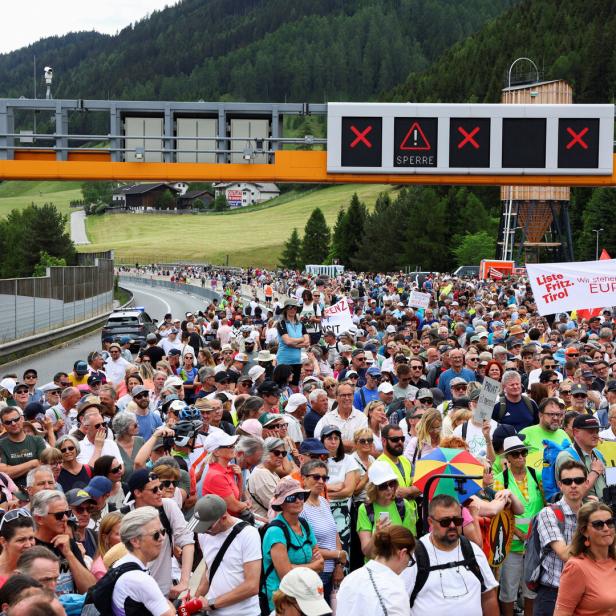 People demonstrate against the growing traffic load, near Matrei