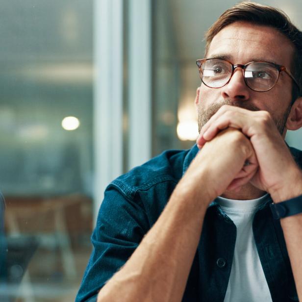Reflection, thinking and business man with idea, creative insight or professional mindset. Planning, vision and serious worker with inspiration, problem solving and writer by glass in startup office