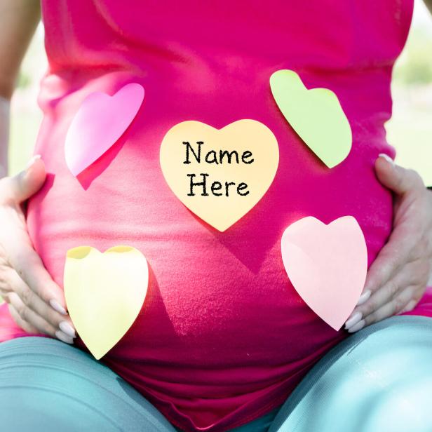 Pregnant woman choosing a name for a baby