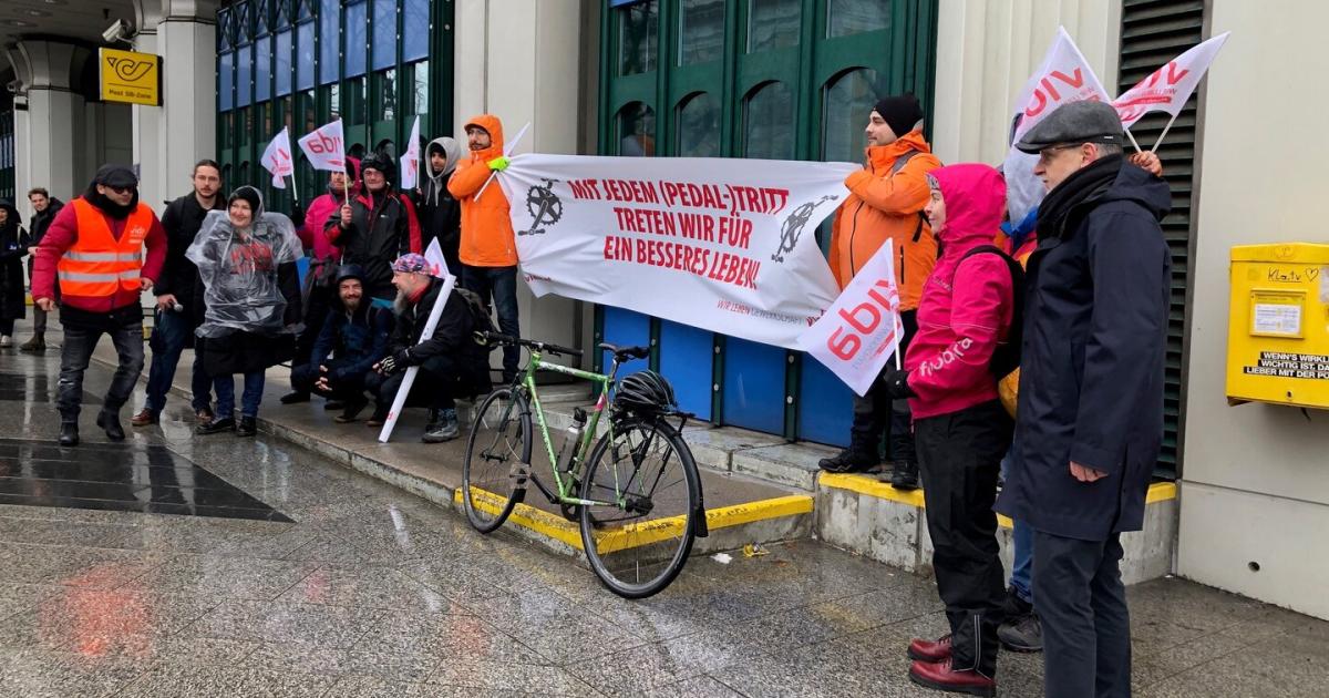 Bicycle messengers brave wind and rain for better working conditions and wages in Vienna protest