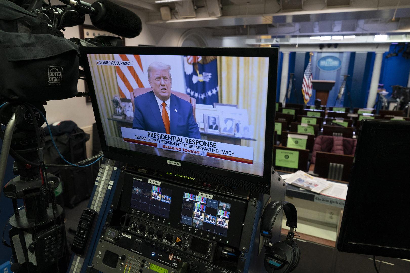 United States President Donald Trump reads a a pre-recorded statement after being impeached by the US House of Representatives