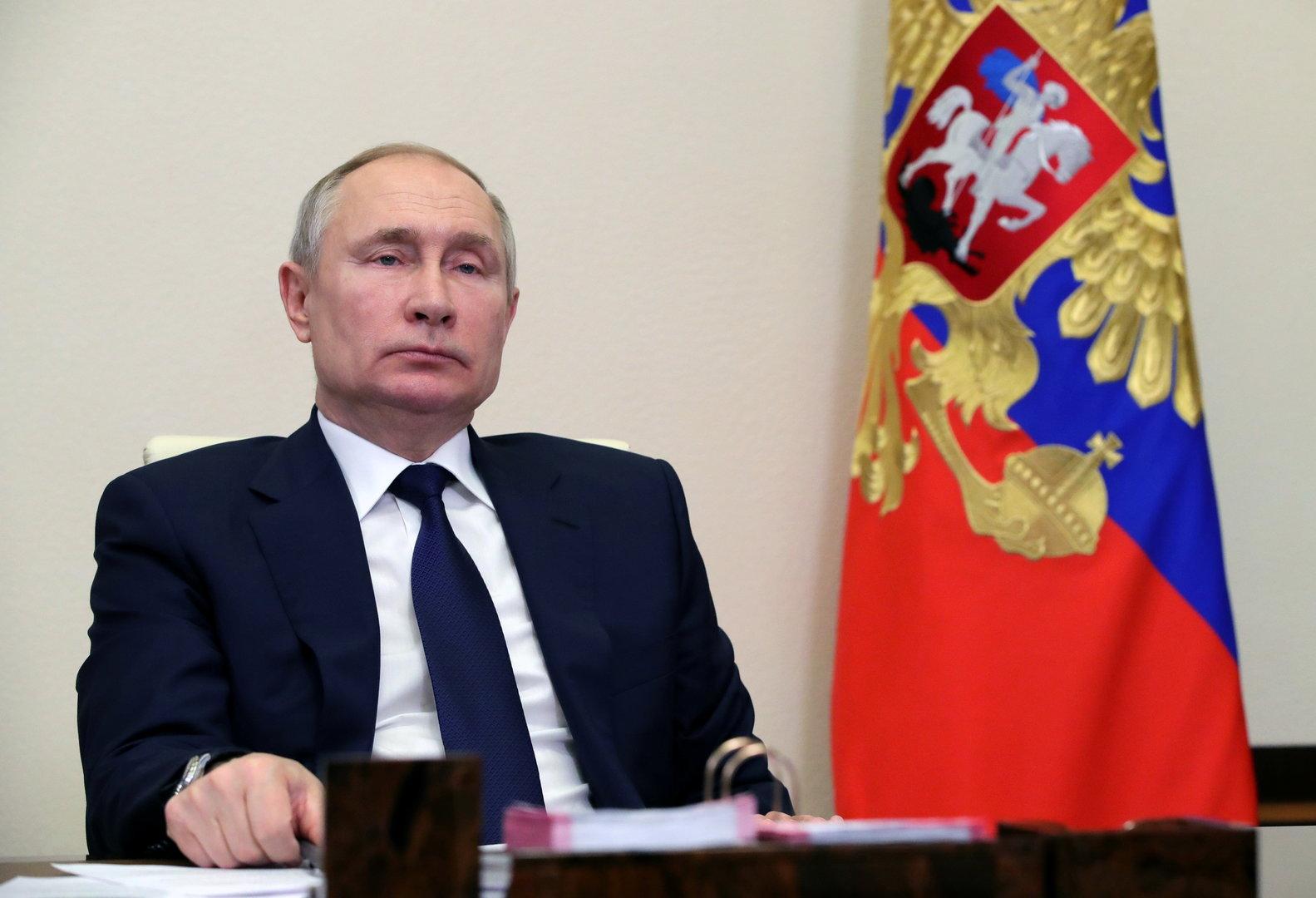 Russian President Vladimir Putin chairs a meeting with leaders of political parties outside Moscow