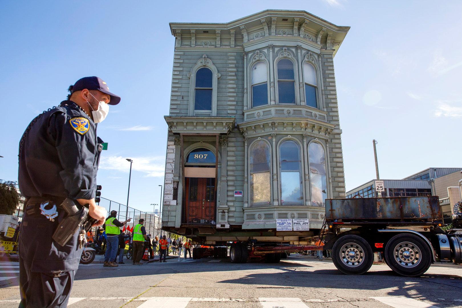 Workers prepare to move a 139-year-old Victorian house to a new location in San Francisco