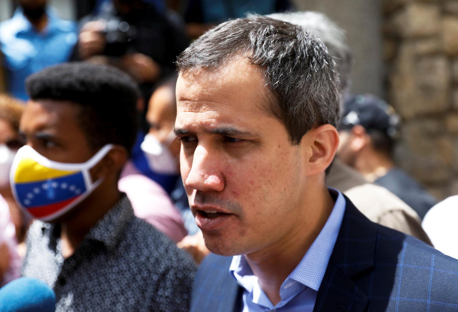 Venezuela's opposition leader Juan Guaido speaks to the media, in Caracas
