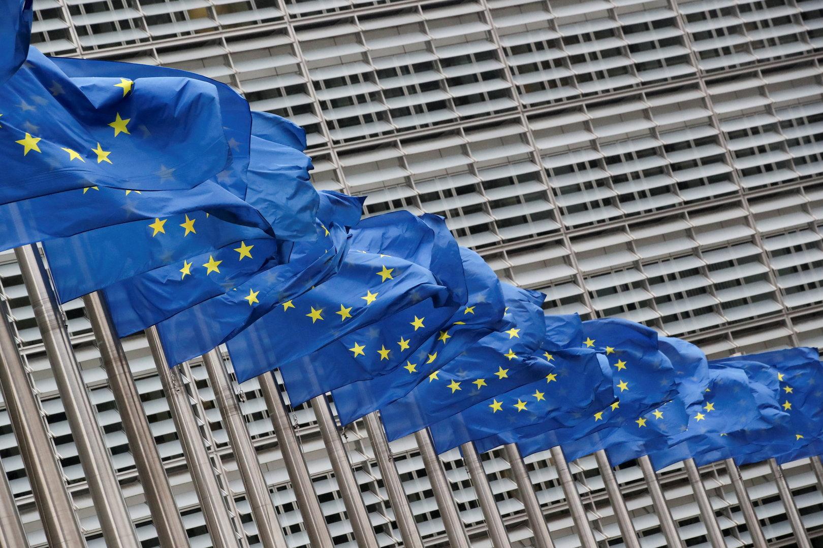 Flags flutter outside EU Commission in Brussels