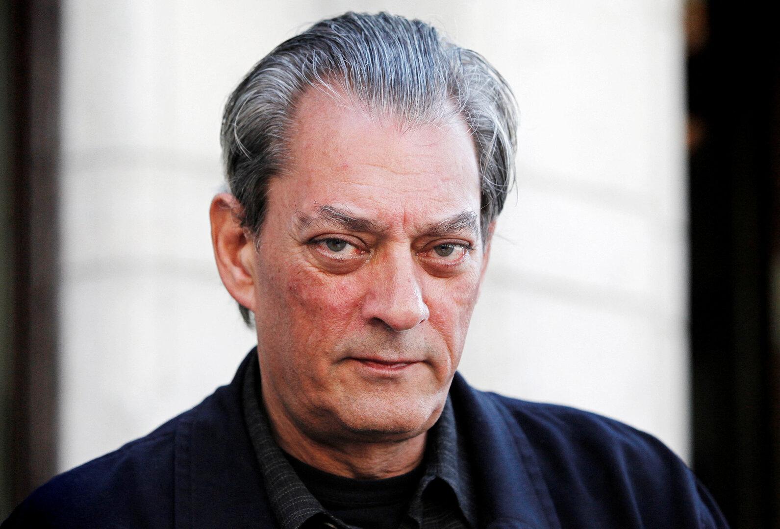 FILE PHOTO: U.S. author Paul Auster poses for a photograph before an interview in Stockholm May 10, 2011.