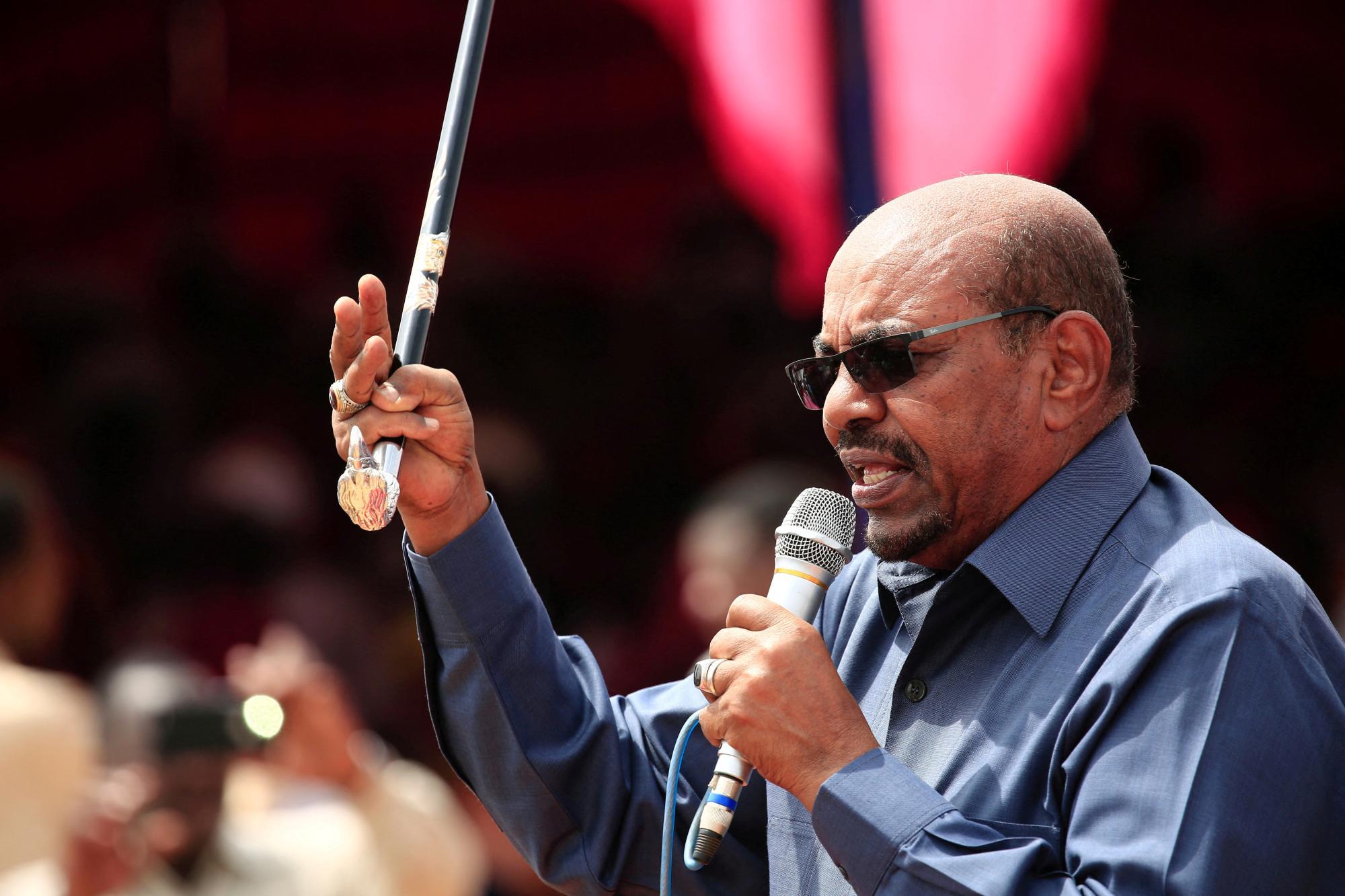 FILE PHOTO: SudanÕs President Omar al-Bashir addresses supporters during his visit to the war-torn Darfur region, in Bilal