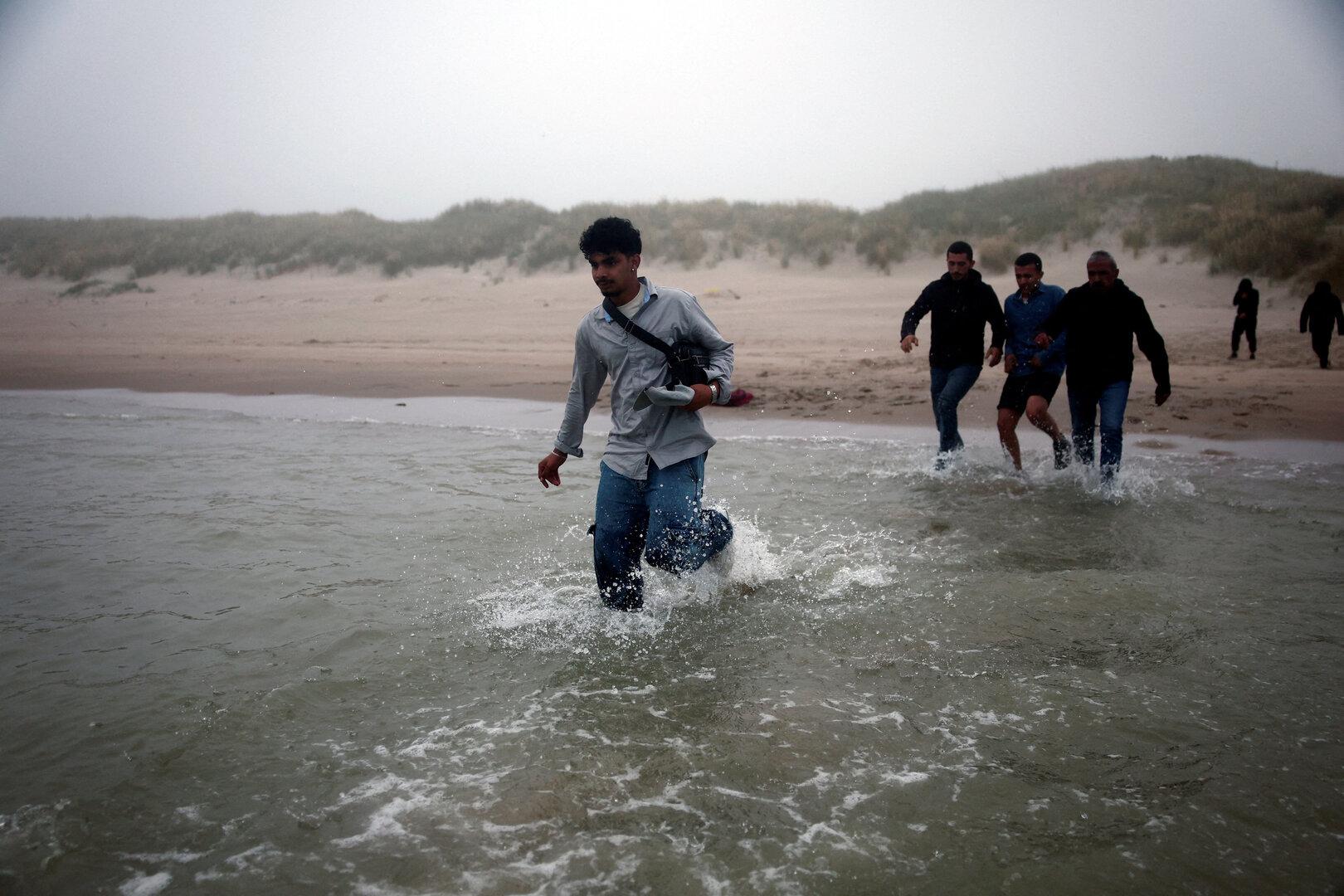 FILE PHOTO: Migrant dinghy heads off the French coast to cross the English channel FILE PHOTO: Migrant dinghy heads off the French coast to cross the English channel