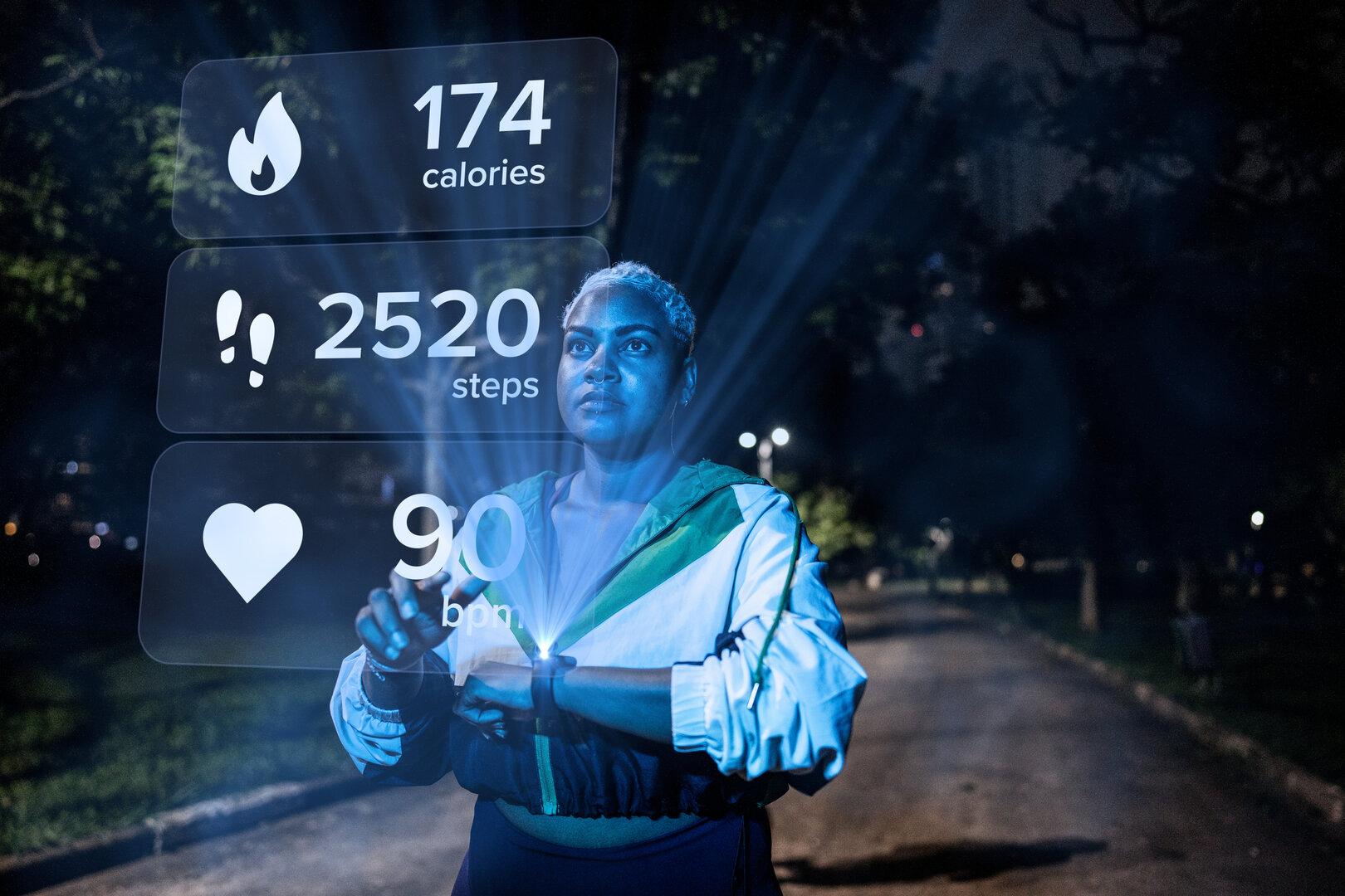 Young woman with smart watch looking at sports infographic hologram at the public park